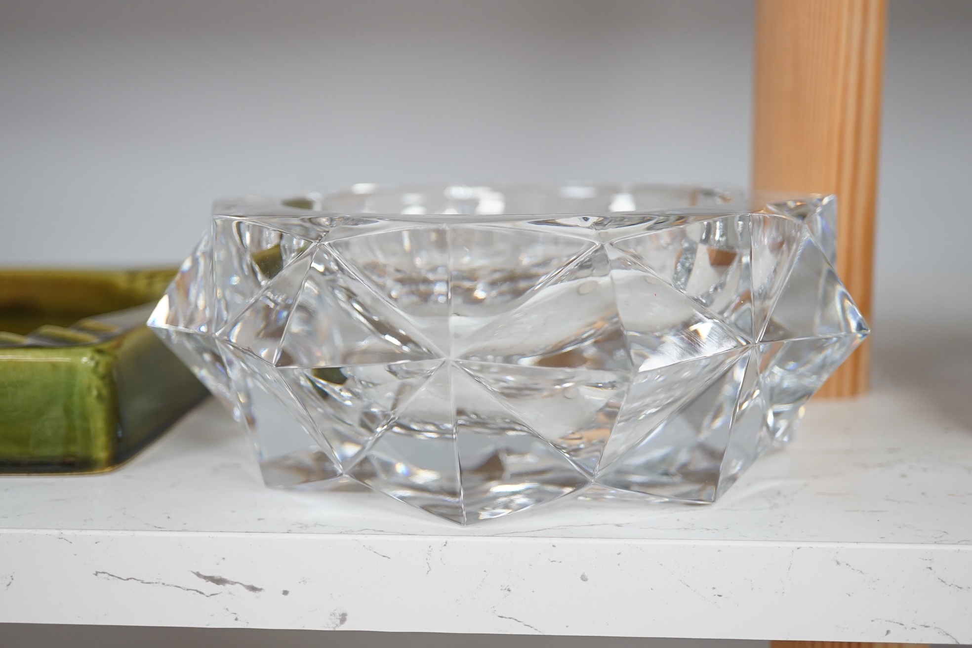 A Baccarat ashtray, 19cm diameter, and a Gefle Swedish ashtray, 20cm wide. Condition - good.